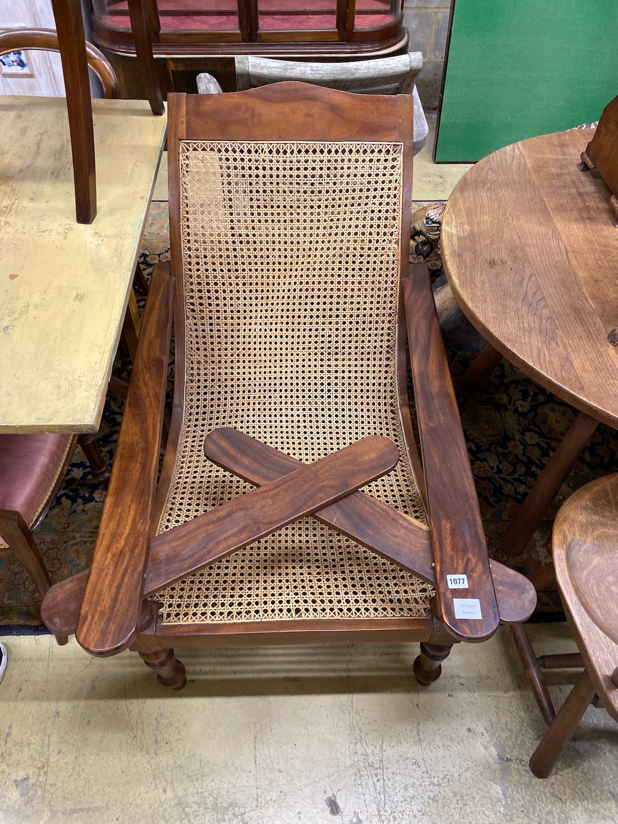A caned hardwood plantation chair, width 66cm, depth 100cm, height 90cm